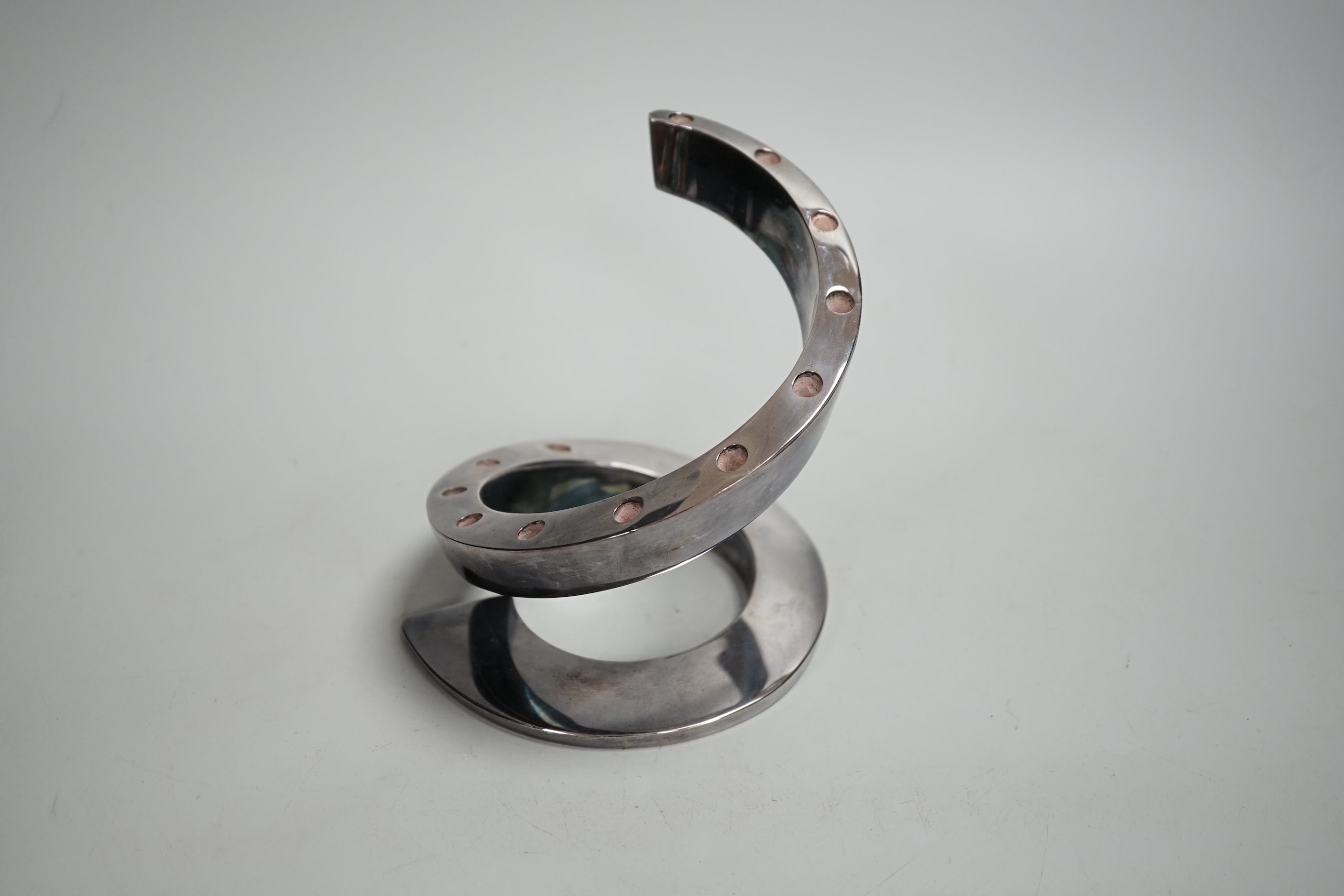 A contemporary Danish style coiled candlestick in chrome finish, stamped Dansk Designs France BV, 13.3cm high